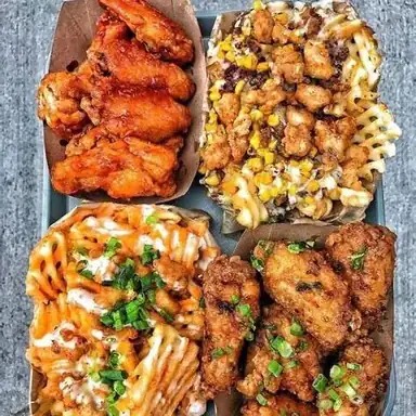 Charred wings, queso fries and smoked dips shareable platter
